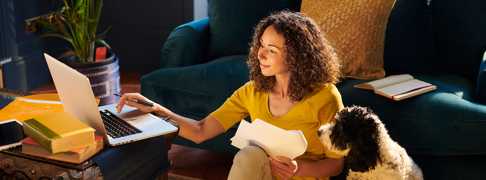 Woman using computer in living room