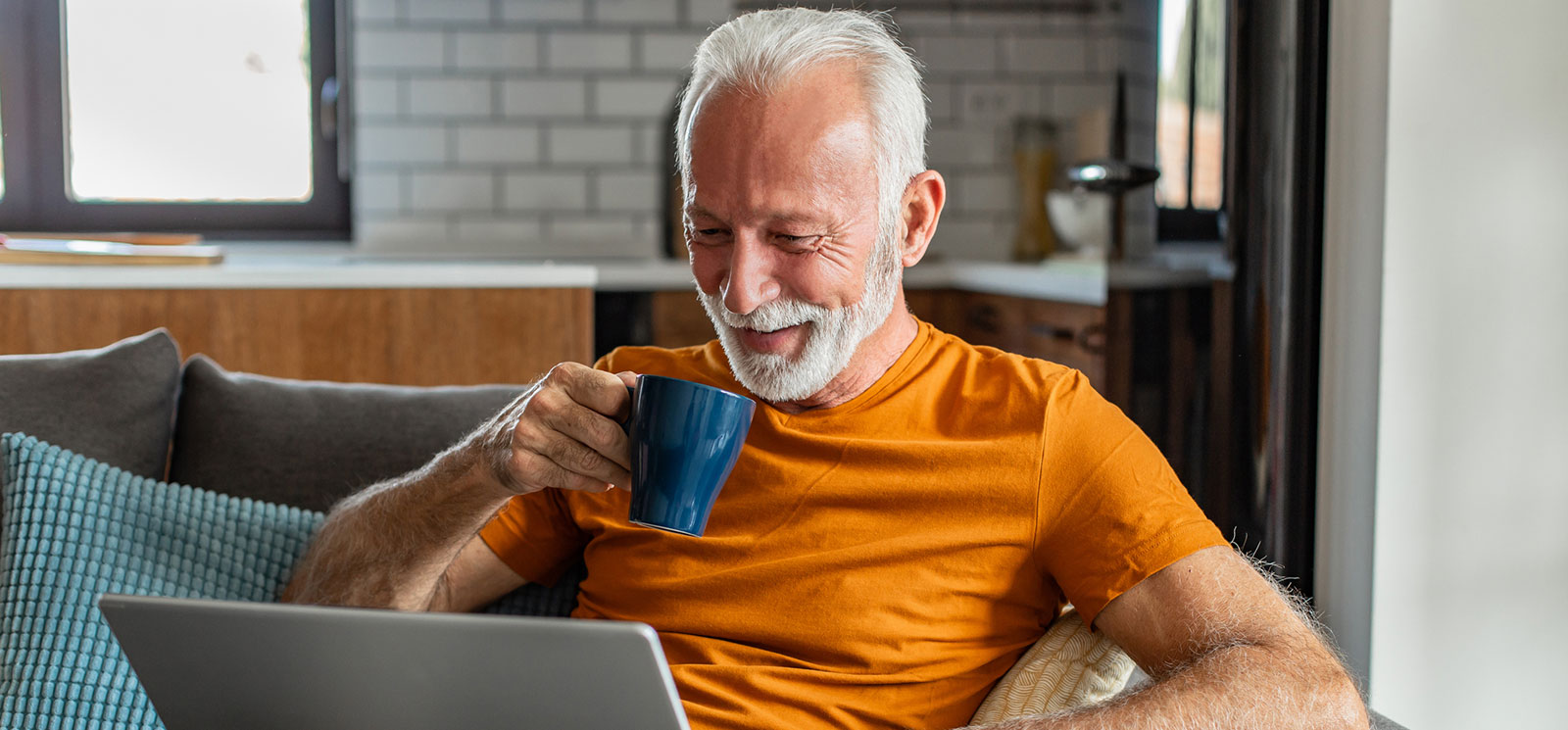 Man using laptop in living room