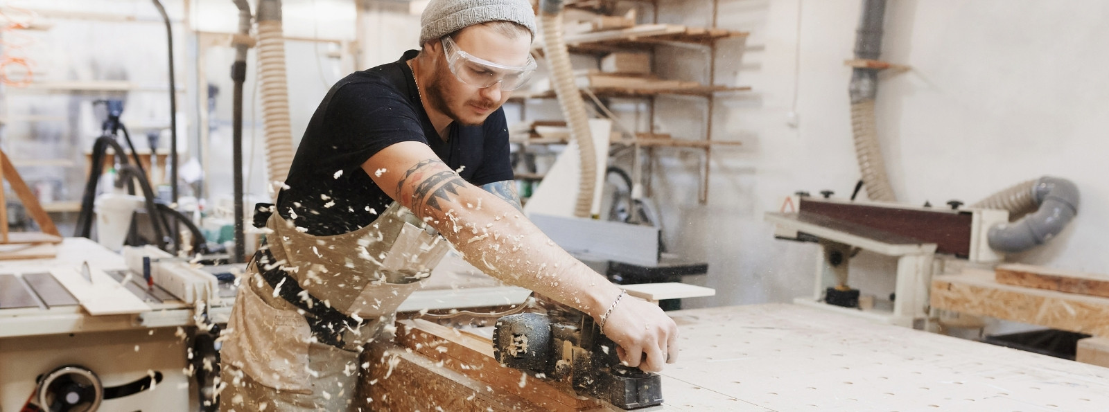 Man sanding down wood